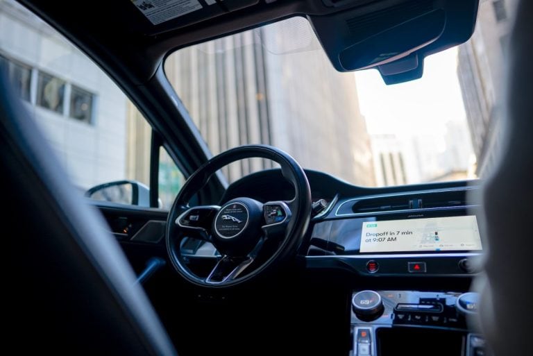 Waymo robotaxi in wet weather conditions